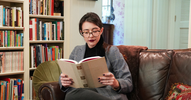 Woman reading in home library
